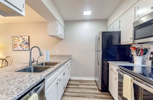 Ocean Ridge Condo | Peaceful & sunlit coastal escape with patio, AC, & W/D - near trails & the beach
