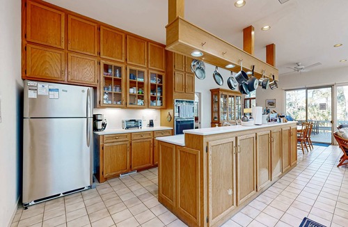Vanderhorst Plantation House | Private home with large deck and views of a lagoon – walk or bike to the beach