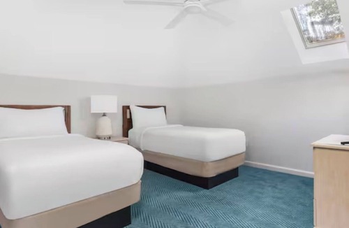 Sea Scape Resort | Relax in a 2-bedroom unit at Beachwoods by Hilton Resort in OBX Kitty Hawk, NC.