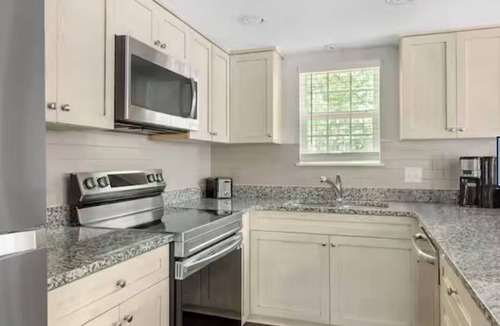 Sea Scape Resort | Relax in a 2-bedroom unit at Beachwoods by Hilton Resort in OBX Kitty Hawk, NC.