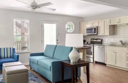Sea Scape Resort | Relax in a 2-bedroom unit at Beachwoods by Hilton Resort in OBX Kitty Hawk, NC.