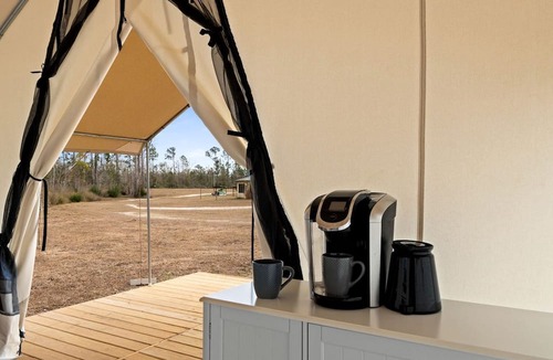 Wewahitchka Cabin | Rustic Lakefront Glamping Under the Stars with River Accesss & Kayaking in Wewahitchka, Florida