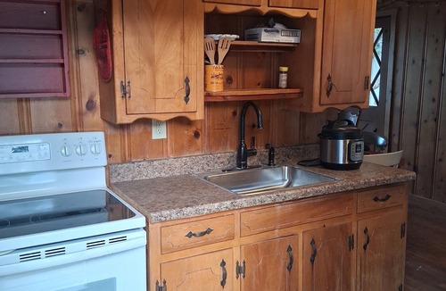 Gordon Cottage | Serene lake front cabin set on bluff overlooking Palo Pinto lake.