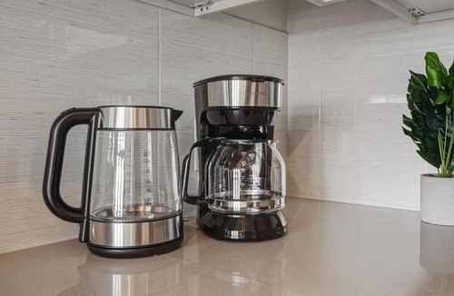 Second Ward Apartment | Skyline Retreat - Free Parking, Pool, Balcony