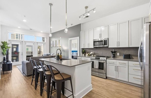 Second Ward Apartment | Skyline Retreat - Free Parking, Pool, Balcony