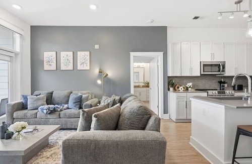 Second Ward Apartment | Skyline Retreat - Free Parking, Pool, Balcony