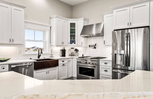 Nags Head House | Sound Living: Exquisite Canal-front home, Infinity Pool, Hot Tub, Elevator