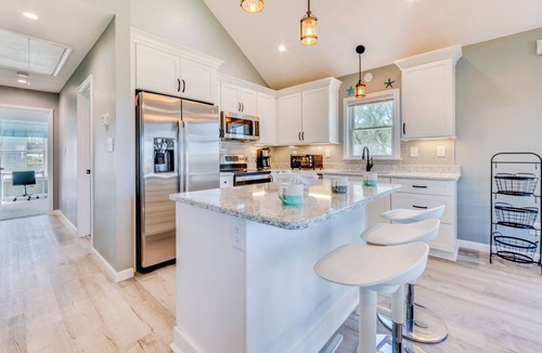 Avon House | Soundside Dog Friendly Home w/Hot Tub, Game Room, Tiki Bar, Screened Porch