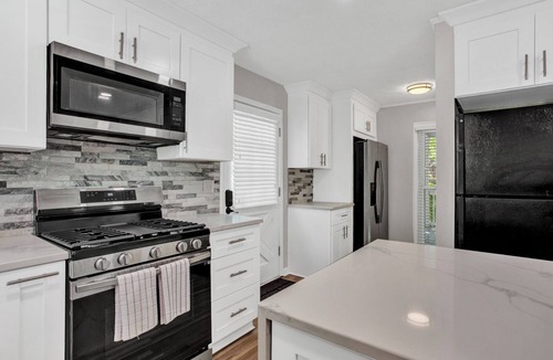 Lilburn House | Spacious 3-level Fun House Pool HotTub Theater GameRoom BBQ