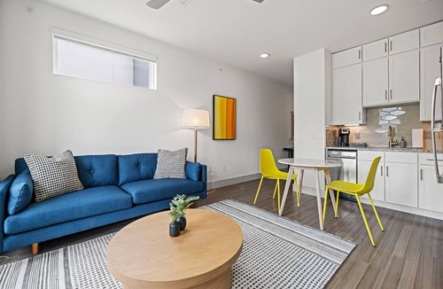 Waller Creek District Hotel | Spacious Apartment for Long-Term Comfort in Downtown Austin | Kitchen & Pool
