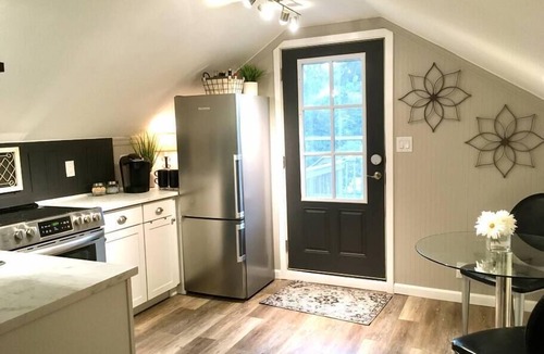 Long View Apartment | The Cupboard Above the Stairs