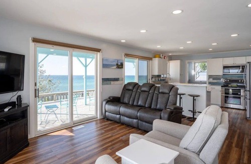 Mears House | This charming vacation home sits directly on Lake Michigan and it delivers!