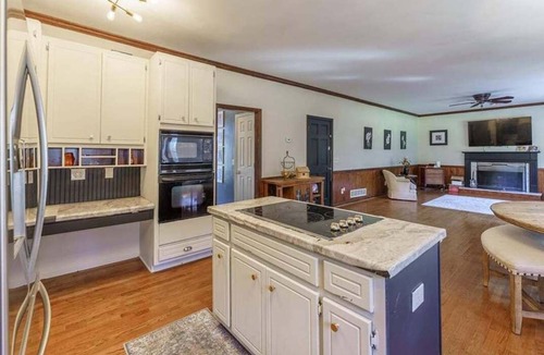 Cumming House | Traditional Home with Long Level Driveway offers media room and 4/2.5