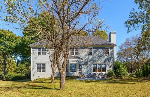 Cumming House | Traditional Home with Long Level Driveway offers media room and 4/2.5