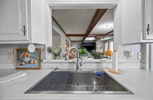 Henderson House | Updated Farmhouse Retreat Near Kerr Lake