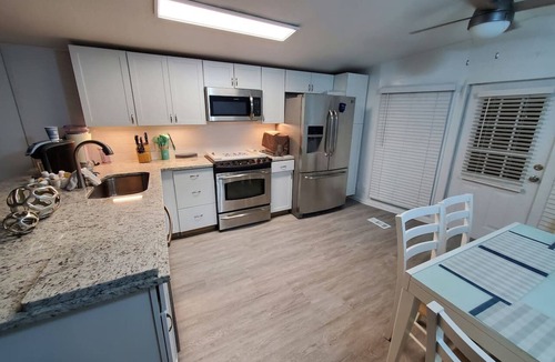 Enchanted Oaks House | Waterfront Retreat, Spacious Outdoor Deck! Dogs