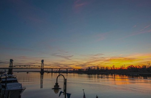 Riverwalk Apartment | Waterfront Sunset Views in Port City Wilmington NC
