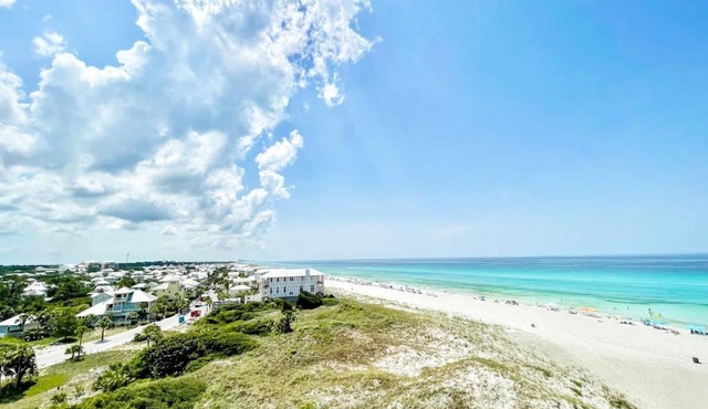 Beachfront condo in gated resort with pools lake access fast WiFi & patio