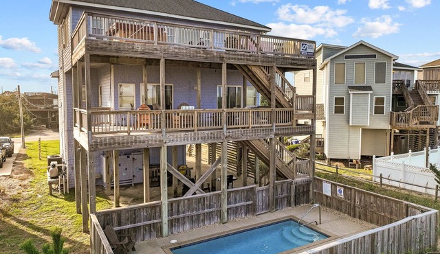 Coastal home with private pool, game room, media lounge, oceanside deck