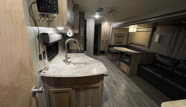 Come Settle in this cozy modern style RV, Nestled in the quiet country side.