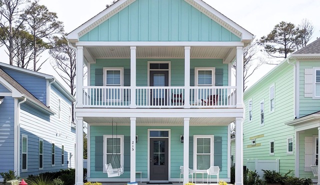 Enjoy sea breezes from double-decker porch - walk to pool, private waterfront.