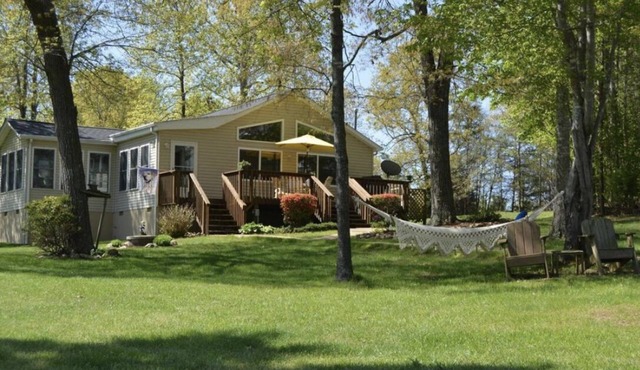 GO JUMP IN THE LAKE at this lovely waterfront home!