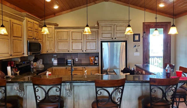 Lovely 4-bedroom elevated house with Front and Back Porches, on a canal