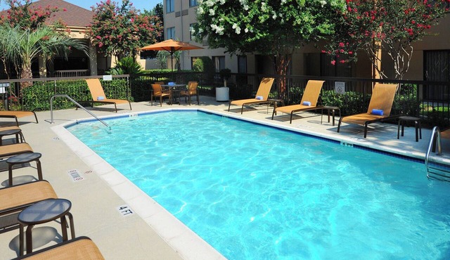 Modern King Room Perfect for Families Visiting Houston | Outdoor Pool Access
