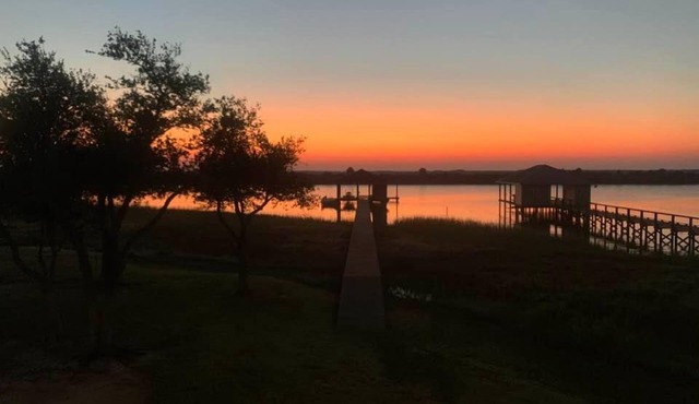 REEL N REST in Hackberry LA ! Waterfront home with beautiful views .