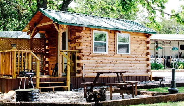 Rustic Log Cabin with Outdoor Fire Pit and Porch in Toronto, Kansas