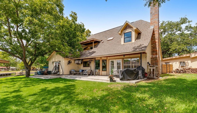 Stunning home with lake views, private island, dock & modern interior