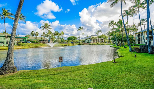 Water-view 3rd-floor condo with community pool & grills - near sights & dining