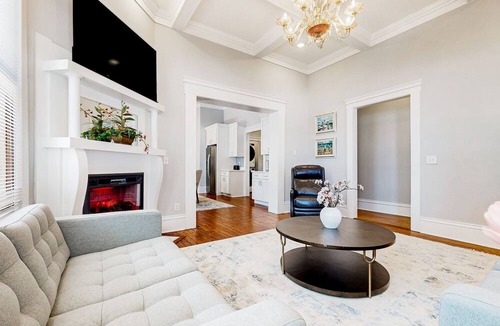Metropolitan House | Dog-friendly duplex with front porch, fenced yard & walkable location